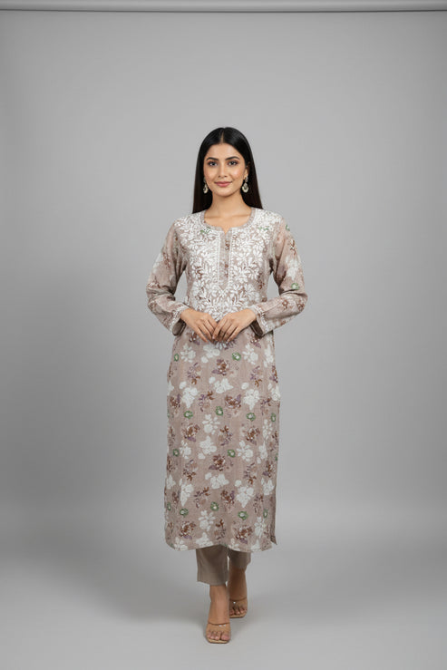 Mannequin wearing a floral dress with a beige background