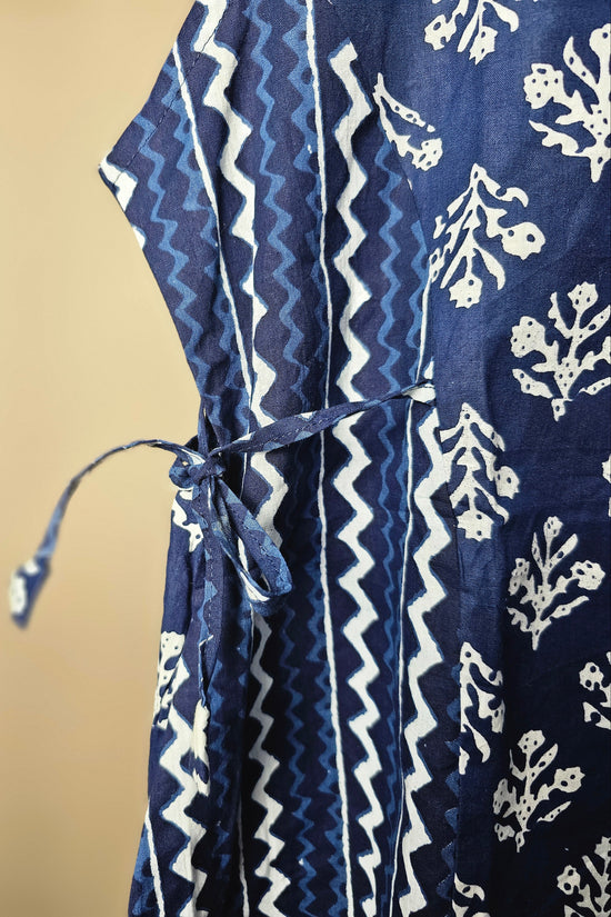 Navy blue fabric with white patterns on a beige background
