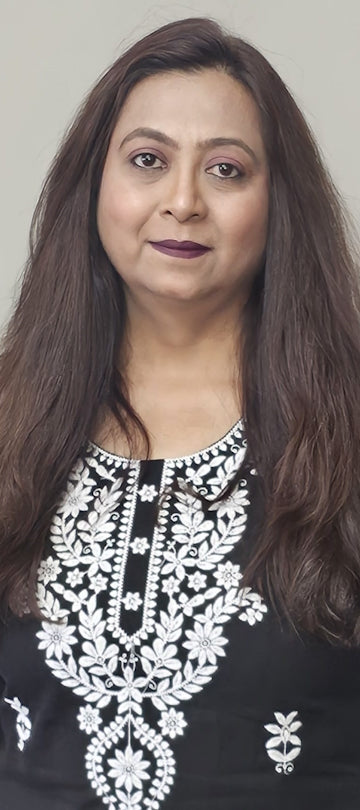 A woman in a black shirt cotton top