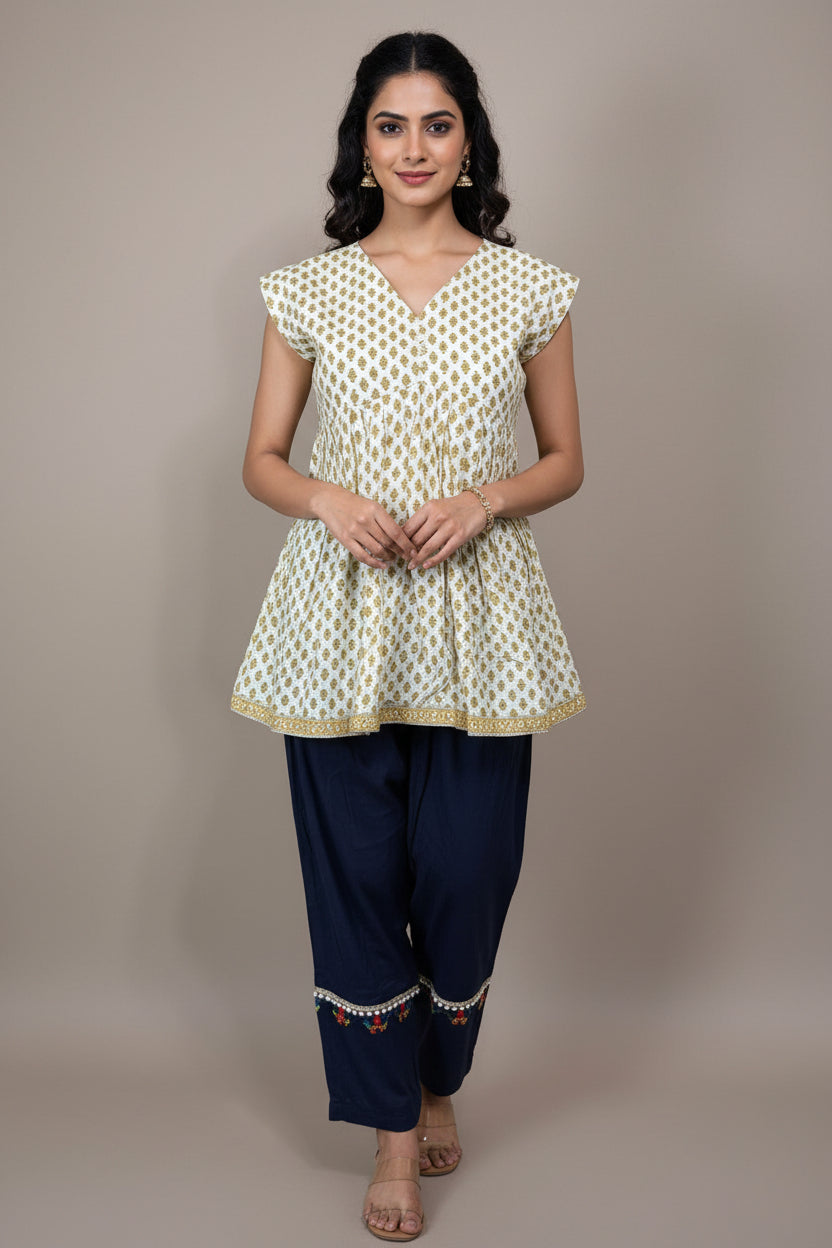 Mannequin wearing a patterned top and dark pants against a plain background