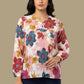Woman wearing a floral blouse against a beige background