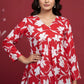 Red floral top with white flowers on a mannequin against a neutral background