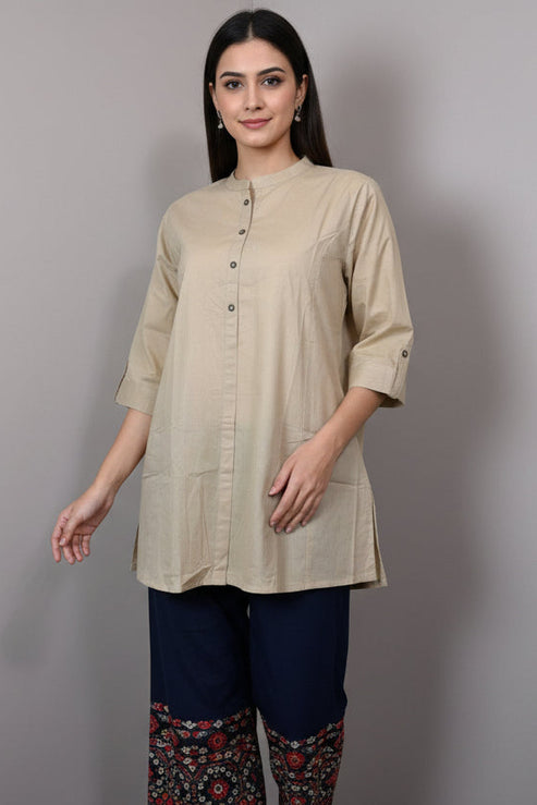 Beige kurta on a mannequin against a plain background