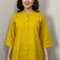 Yellow shirt on a mannequin with a gray background