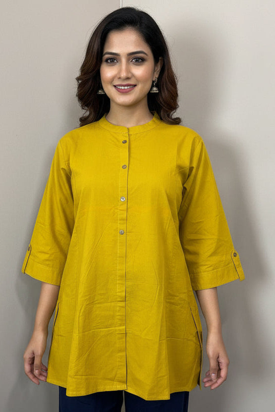 Yellow shirt on a mannequin with a gray background