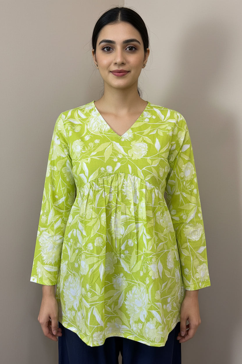 Green floral blouse on a mannequin against a brown background