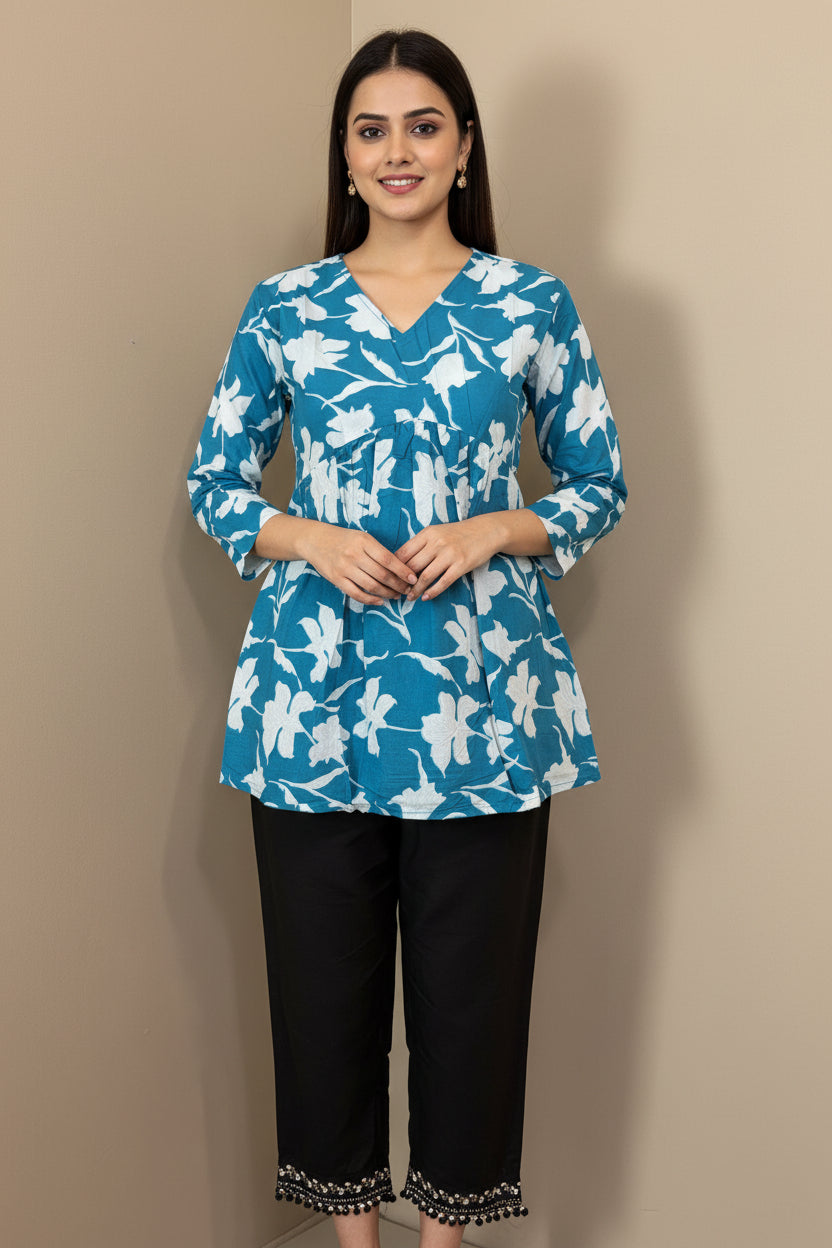 Blue floral top with white flowers on a mannequin against a beige background