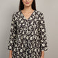 Floral-patterned top on a mannequin against a neutral background