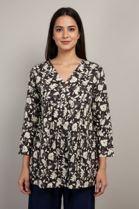 Floral-patterned top on a mannequin against a neutral background