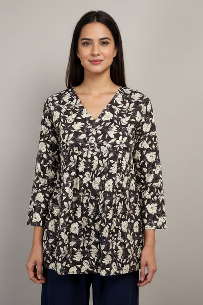 Floral-patterned top on a mannequin against a neutral background