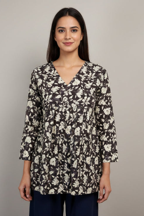 Floral-patterned top on a mannequin against a neutral background